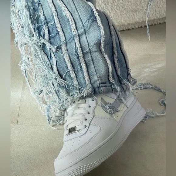 Lightly worn Frayed distressed denim jeans in a size 30 (9 US)
